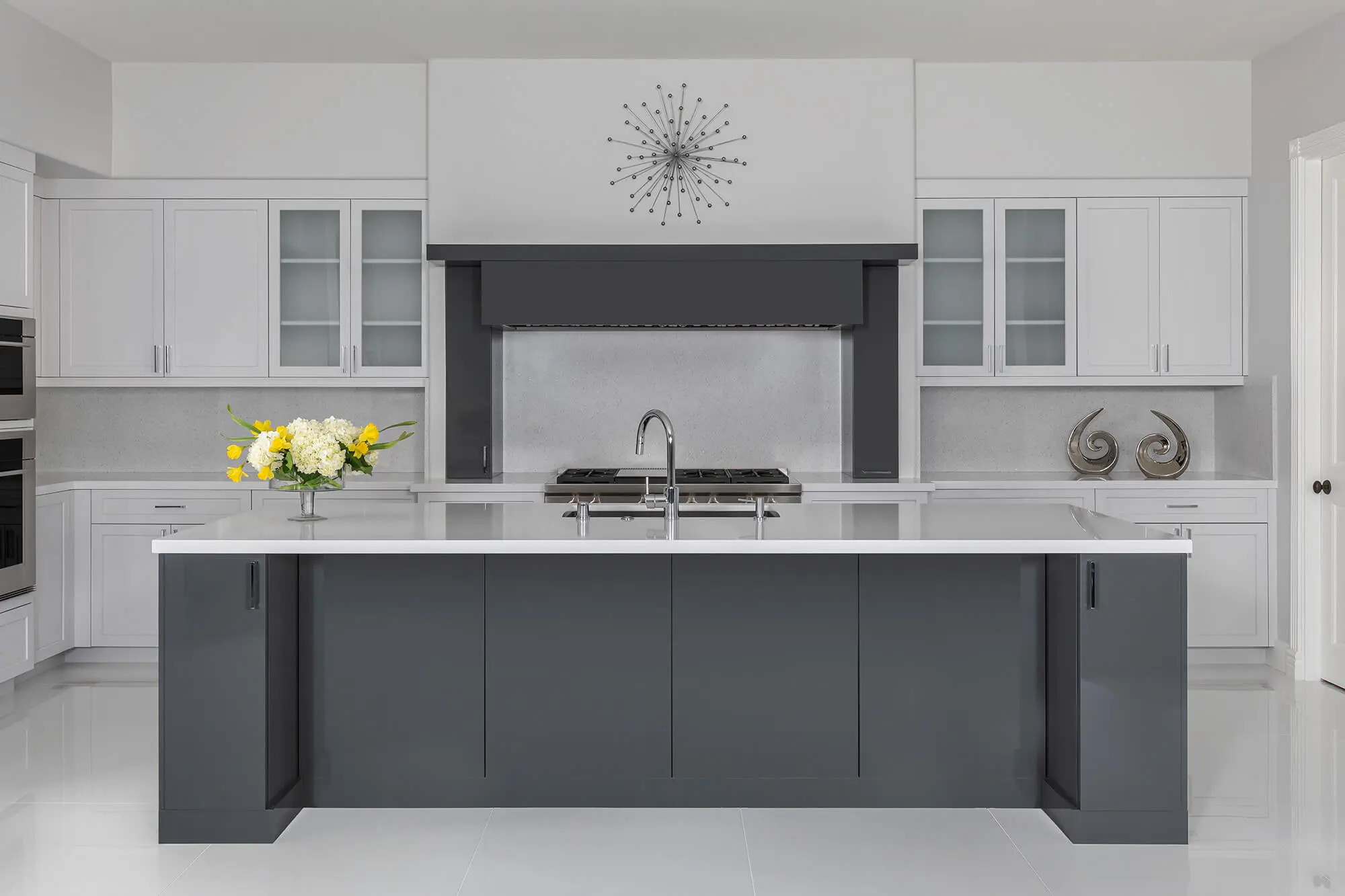 Custom Kitchen Remodeling project featuring a spacious island with seating and pendant lighting.