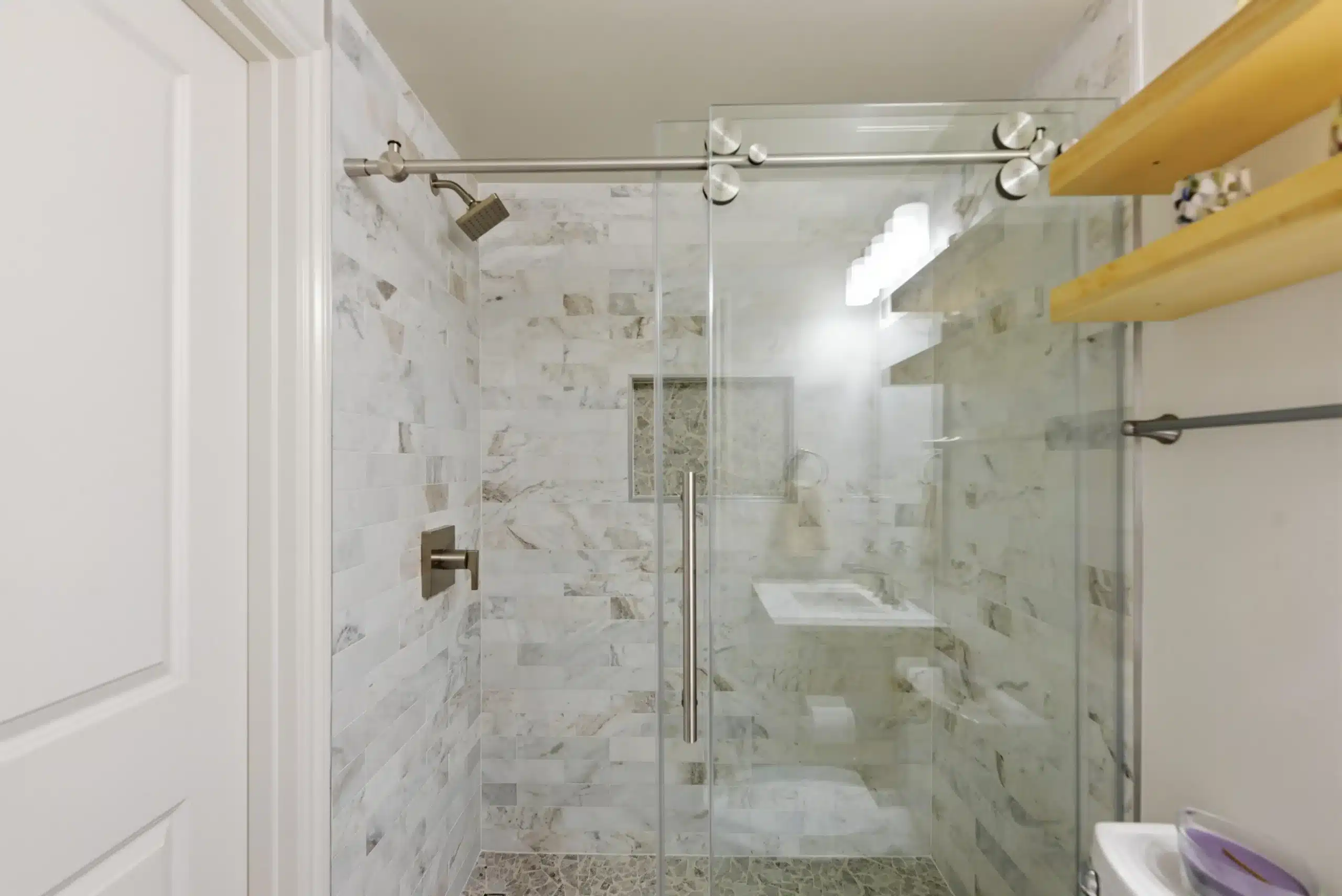 Bathroom Remodeling in Montreux with a custom walk-in shower, glass enclosure, tiled walls, and modern fixtures